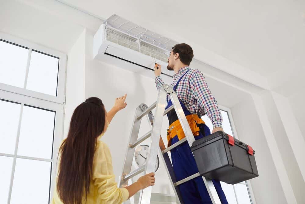 HVAC technician working with homeowner in Morristown, NJ
